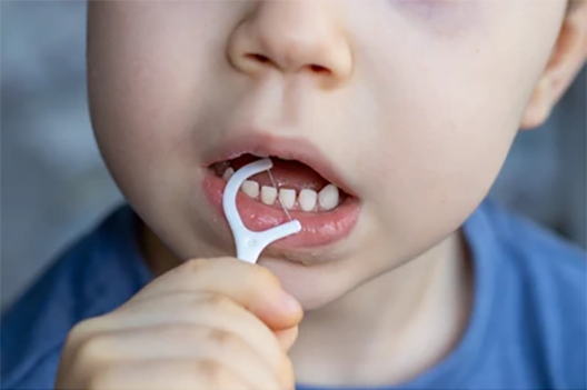 boy-cleaning-his-teeth-toothpick-260nw-2120151392